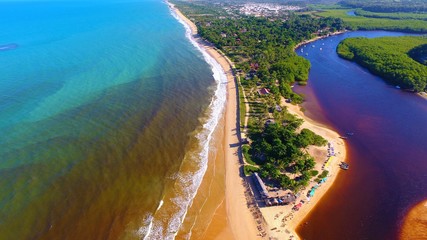 Caraíva, Bahia, Brazil: Aerial view of a beautiful beach with two colors of water. Fantastic landscape. Great beach view