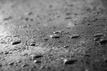 Water drops on a black and white surface
