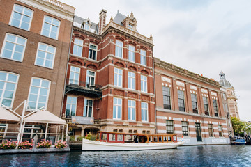 Naklejka premium Amsterdam, Netherlands September 5, 2017: Canal in Amsterdam and buildings