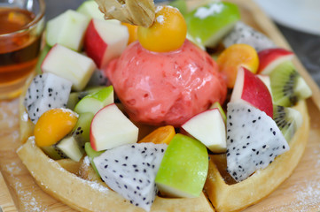 waffle with fruit and ice cream topping