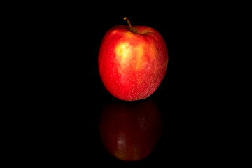 Fototapeta na wymiar Red apple isolated on black background. Image of a fresh natural organic fruit. 