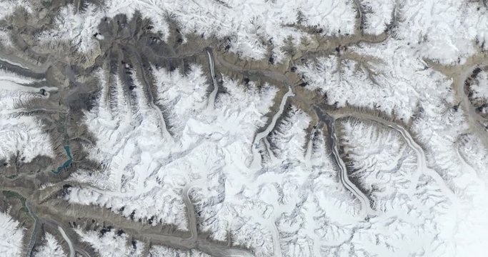 Hurtling toward earth, out of control, over Khurdopin mountains, Pakistan. Vibration and camera shake. Elements of this image furnished by NASA