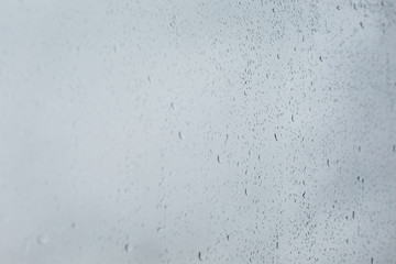 Water drops on the glass. Raindrops on the window in soft focus