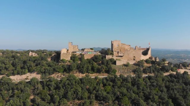 Landscape of the Palafolls Castle ruins on a beautiful sunny day. Catalonia Spain. Aerial view travelling