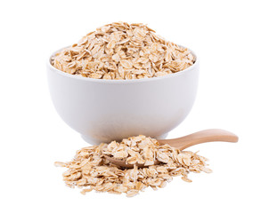 Oat flakes pile in white bowl on white background