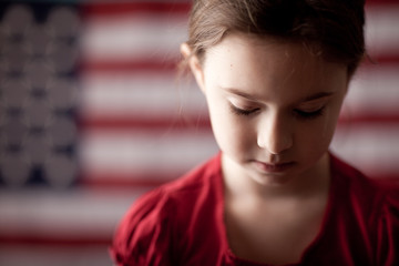 Sad Girl in Front of American Flag