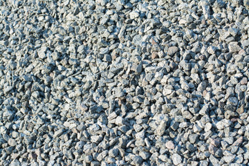 Big pile of crushed stone against an evening light. Material for road construction