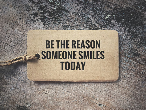 Motivational and inspirational quote - Be the reason someone smiles today. Vintage styled background.