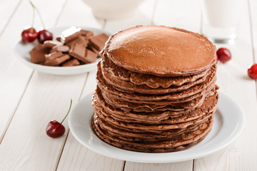 Big pile of brown pancakes
