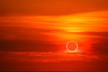 Fotobehang Rood solar eclipses occur in the sky while the sunset times  © darkfoxelixir