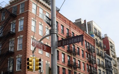 New York City Soho Downtown District Spring Street and West Broadway Signs Lower East Side Streets Historic Apartment Buildings - obrazy, fototapety, plakaty