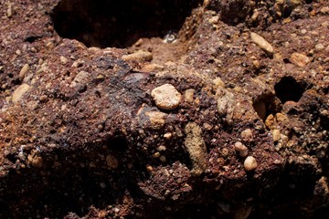 Rock texture. Protuberances and roles. Rock background.
