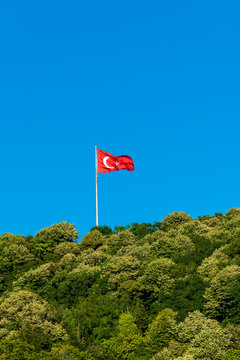 Turkish flag waving in blue sky