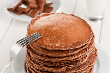 Fork on pile of pancakes