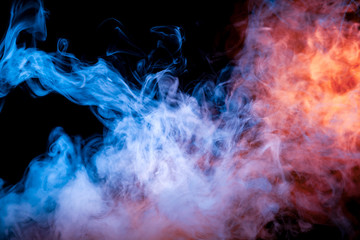 Multicolored illuminated smoke rolling from blue to red along substance molecules swirls on a dark background, depicting a decorative pattern.