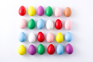 Easter holidays concept with colorful easter eggs pattern on white background 