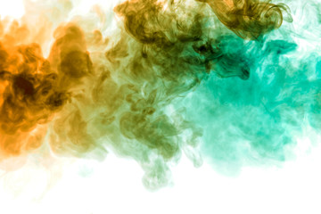 Background of blue and green wavy smoke on a white isolated ground. Abstract pattern of steam from vape.