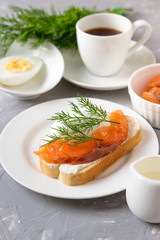 Sandwich with cheese, trout coffee for breakfast.