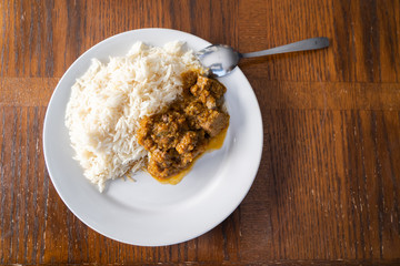 White boiled rice with spicy ofada stew a Nigerian traditional meal
