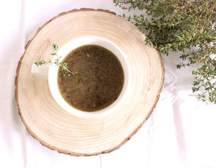 Beluga lentil soup with Winter Savory Herbs on a white background. Just like the red lens, it does not need to soak it
