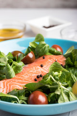 Salmon salad and condiments bowls
