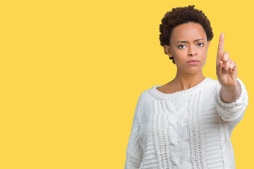 Beautiful young african american woman wearing sweater over isolated background Pointing with finger up and angry expression