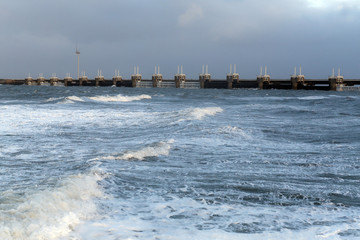 Storm surge barrier to protect against storm and flood
