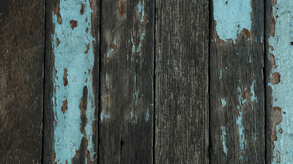 Texture or background of yellow, green and blue pained and plain wood wall, economic design from reusing the old wood, value added tactics for making more money and creating unique fashionable style