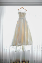 white wedding dress on a hanger
