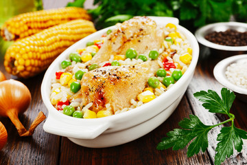 Chicken legs baked with rice and vegetables