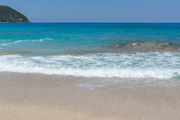 Fototapeta na wymiar Seascape with Agios Ioanis beach with blue waters, Lefkada, Ionian Islands, Greece