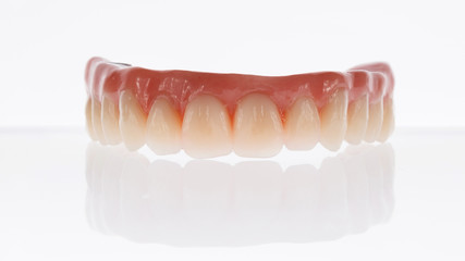 Dental composition of the prosthesis of the upper jaw on a white background