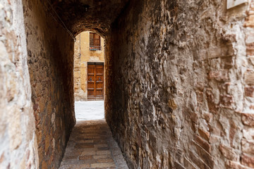 Narrow street in the old town in Tuscany
