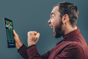 Man celebrating victory after making bets at bookmaker website