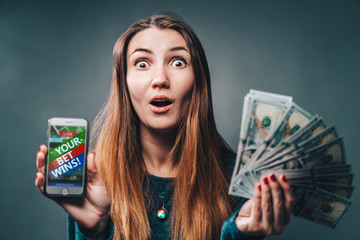 Young attractive girl with cash ward in hand