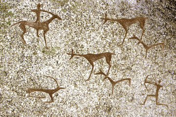 image of ancient hunting ancient man on the cave wall. history of antiquities. archaeology.