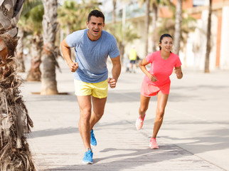 Couple running outdoors