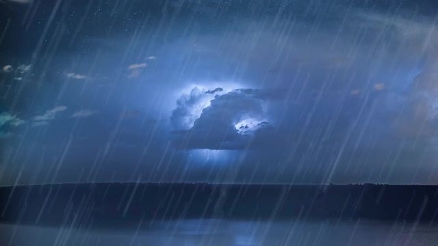 Night ocean storm at sea with rain and lightning