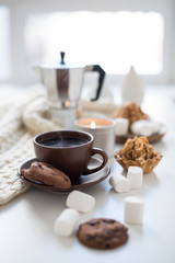 Cozy home breakfast with coffee and cookies on table