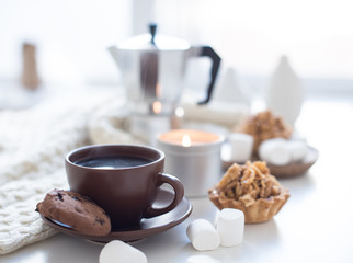 Cozy home breakfast with coffee and cookies on table