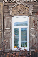 an old window of a wooden siberian house in Irkutsk