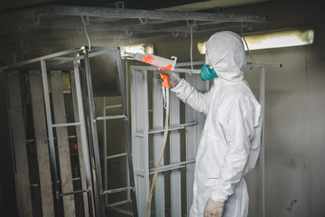 at the factory painting spray gun, Painter working with airbrush