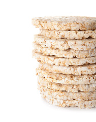 Stack of crunchy rice cakes on white background