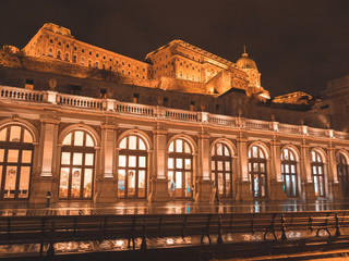 Obraz premium Budapest city by night in Hungary, street on Danube river on the Buda Castle side, view towards the castle