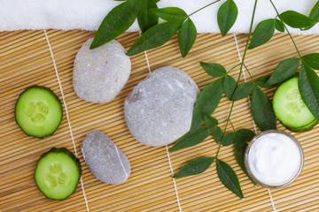 Natural Skin Care Products. Top view ingredients on table concept of the best all natural face moisturizer. Spa stone and white towel