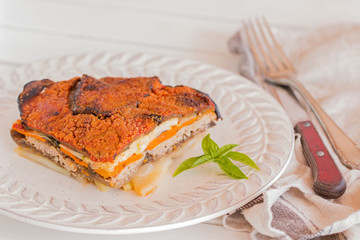 A slice of baked vegetable pie.