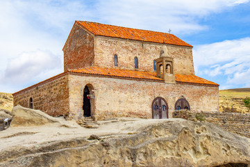 Beautuful View to Ancient Orthodox historic Church in antique cave city Uplistsikhe. The Uplistsikhe 9th-10th century three-nave basilica and vale of Mtkvari river, Shida Kartli, Gori, Georgia.