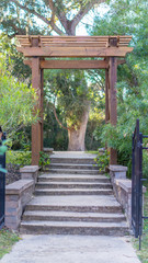 Path leading under a wood trellis