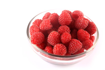 raspberry in bowl isolated on white background