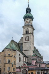 The parish church St Nicolas's Stadtpfarrkirche on the central square Oberer Stadtplatz, the true heart of the historic city center of Hall in Tyrol, Austria